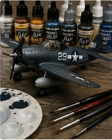 Brush Painting Small Details — scale aircraft model with fine brushes and paint palette on a workbench